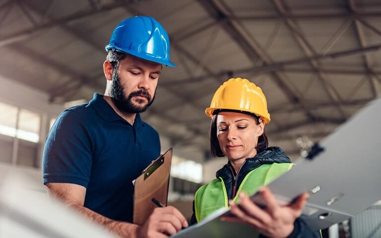 Engineers planning CNC machinery